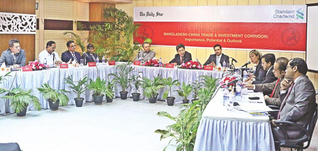 From left, Ron Lim, managing director of Eastcompeace Smart Card Bangladesh; Shahidullah Azim, vice-president of BGMEA; Syed Afsor H Uddin, CEO of Public Private Partnership Office; Nabhash Chandra Mandal, executive member of BoI; Mahfuz Anam, editor of The Daily Star; Ma Mingqiang, Chinese ambassador to Bangladesh; Abrar A Anwar, CEO of Standard Chartered Bangladesh; Patricia Wong, head of network corridor of StanChart China; Alamgir Morshed, head of financial markets at SCB; Syed Sadek Ahmed, MD of Space Sweater; and KG Moazzem, additional research director of CPD, attend a roundtable on Bangladesh-China Trade and Investment Corridor, at The Daily Star Centre yesterday. Photo: Star